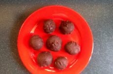 Red Plate With Chocolate Covered Peanut Butter Balls