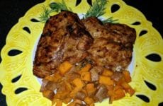 Bone in Rib Pork chop plated up with yams and