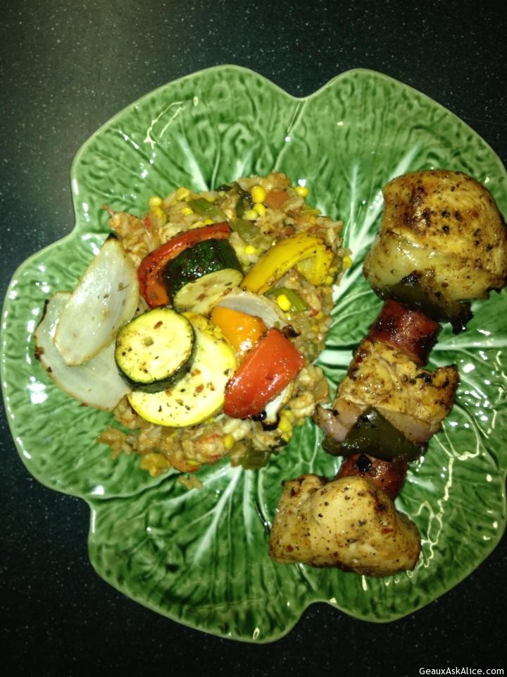 Chicken and Veggie Kabobs plated up with spicey rice pilaf