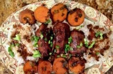 Baked duck platted up with yams.