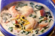Bowl Of Spinach And Shrimp Chowder Topped With Lemon Zest