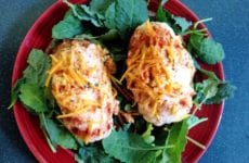 Stuffed Potatos Plated Up On A Bed Of Lettuce.