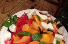 Dish Of Heirloom Tomato Salad With Basil And Mozzarella