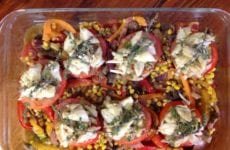 BROILED CREOLE TOMATOES TOPPED WITH AVOCADO VINAIGRETTE INFUSED CRABMEAT