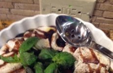 Fresh Slices of Mozzarella with Balsamic Reduction Sauce and Fresh Basil