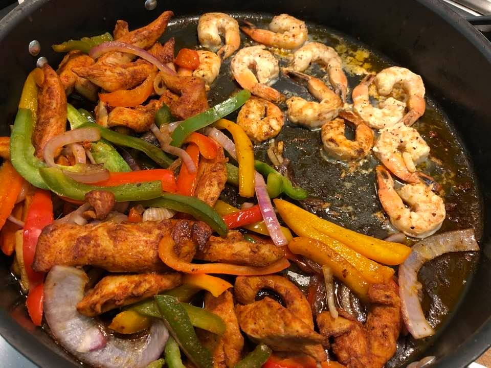 Mix of chicken and shrimp fajitas; veggie loaded pasta and shrimp salad