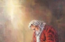 Santa kneeling with baby Jesus