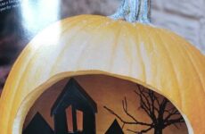 Cut out pumpkin with village inside!