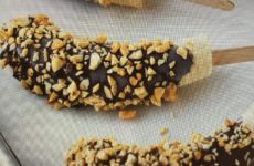 Frozen Chocolate Peanut Covered Bananas on a Stick