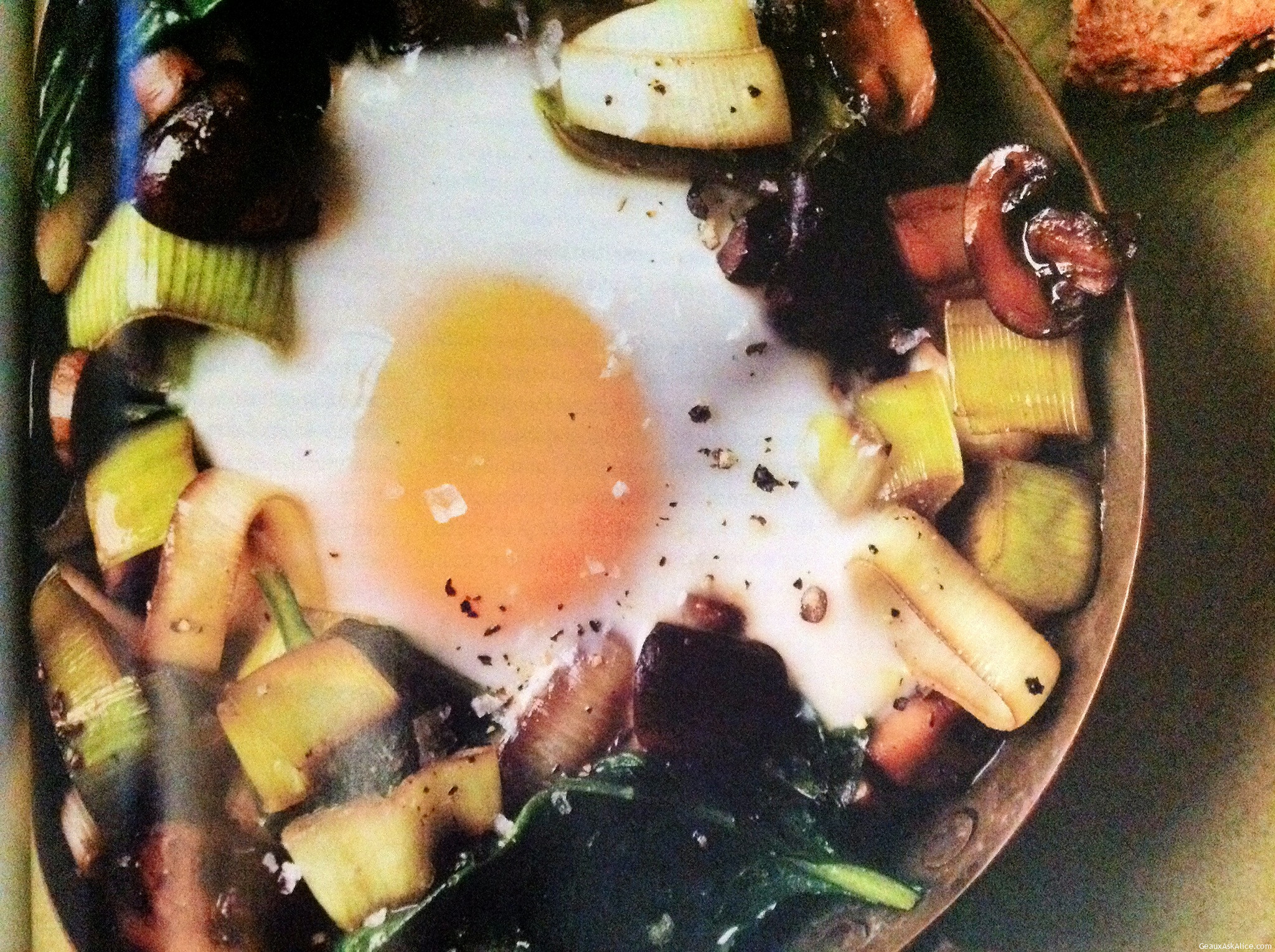 BAKED EGGS OVER SAUTEED MUSHROOMS AND SPINACH